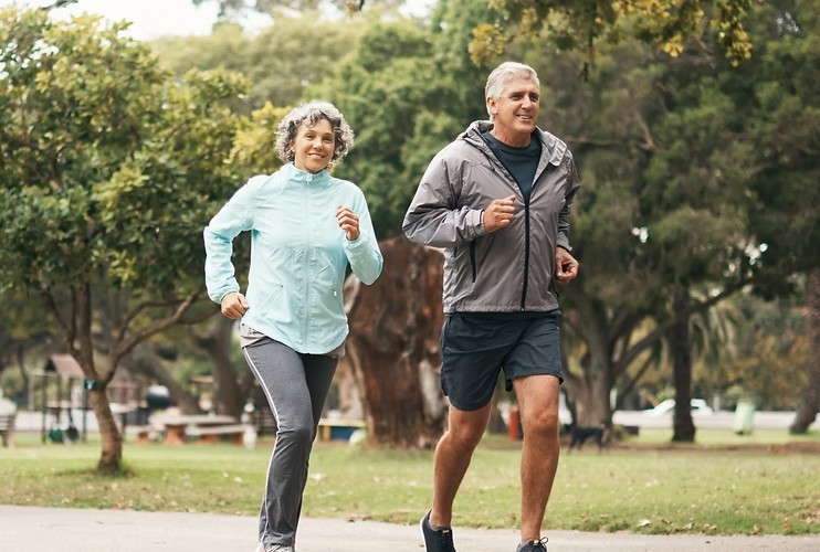 A couple jogging in a park